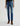 Person wearing blue jeans on a white background