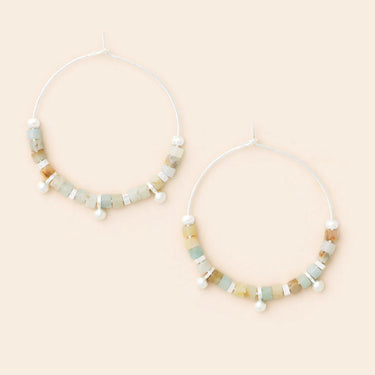 Two beaded necklaces on a beige background