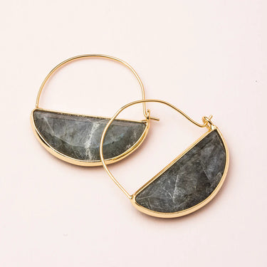 Gold hoop earrings with semi-circular stone inlays on a light background