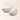 Gold hoop earrings with blue stone half-circle pendants on a light pink background