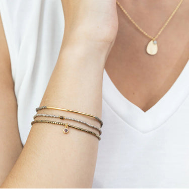 Set of three stacking bracelets on a woman's wrist