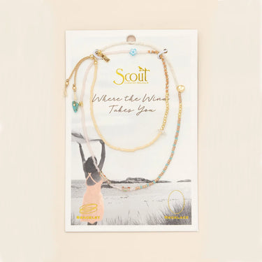Scout jewelry card with necklaces on a scenic background