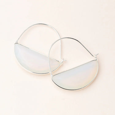 Large hoop earrings with reflective prism on a light background