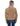 A woman viewed from the back wearing a tan suede jacket with a light beige sherpa collar and dark blue jeans, set against a plain white background.