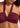 Wrap halter burgundy swim top on a model on a white background