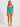 Woman wearing a turquoise one-piece swimsuit on a white background