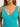 Teal one piece swimsuit worn by a woman on a white background