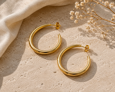 A pair of half hoop 45mm hoop earrings with a stud back