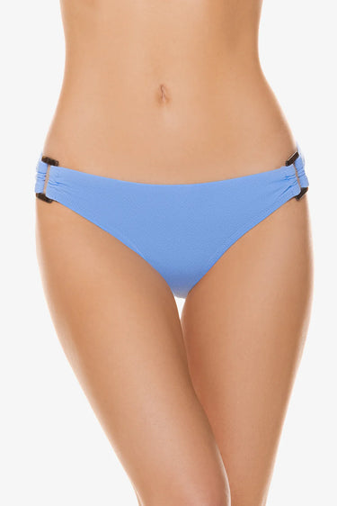 Blue bikini bottom worn by a person on a white background