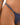 Navy blue bikini bottom with thin straps on a person's waist against a neutral background