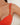 Close-up of a red bikini top with thin straps on a white background