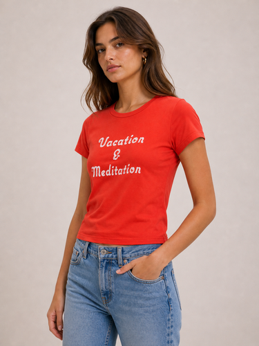 Red baby tee with vacation and meditation written across the front with blue jeans