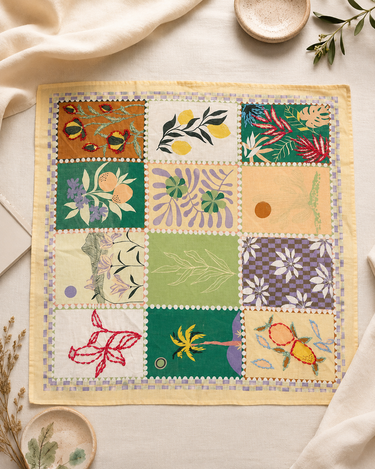 A patchwork scarf on a neutral table