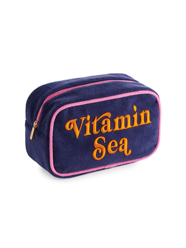 Navy blue pouch with 'Vitamin Sea' text on a white background
