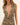 Leopard print swim cover up with a plunging neckline on a beige background
