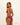 Woman wearing a pink bikini on a beige background