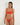 Woman wearing an orange bikini against a white background