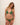 Woman wearing a green bikini against a plain background