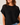 A close-up of a woman wearing a black open-knit short-sleeve top with a crew neck, paired with blue jeans, against a plain light beige background.