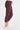 A side angle of a woman wearing leggings with drawstring waist with zippered mini pockets team up with ruched front leg panels, front/back pockets and a cropped silhouette.