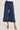 Navy blue cargo pants worn by a person on a white background