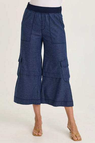 Navy blue cargo pants worn by a person on a white background
