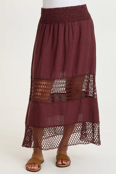 Maroon skirt with lace details on a white background