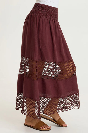 Maroon skirt with lace details on a white background