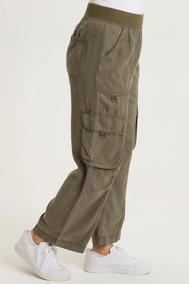 a woman wearing cropped cargo twill pants in moss green