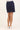 Navy blue skirt worn by a person on a white background