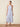 Woman wearing a floral dress on a beige background