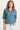 Woman wearing a blue denim shirt with a white background