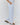 person wearing a striped pair of pants standing sideways
