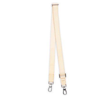 A light beige leather shoulder strap with silver metal snap hooks on both ends, displayed vertically against a solid white background.
