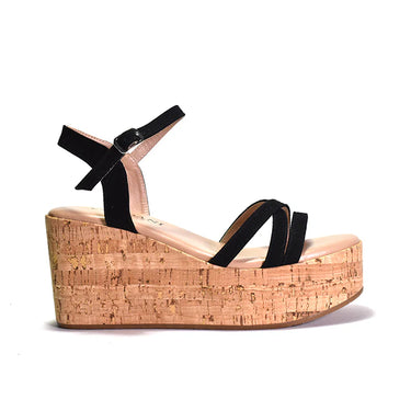 Wedge sandal with cork platform and black straps on a white background
