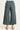Teal wide-leg pants on a white background