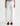 Person wearing white wide-leg jeans on a white background