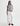 Woman wearing a gray t-shirt and white pants on a white background