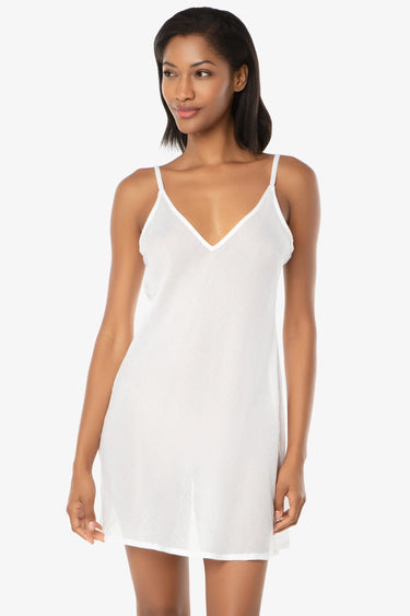 woman wearing a white slip on a white background