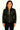 Woman wearing a lightweight black leather jacket with a zip-front closure and stand-up collar.