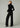 Full back view of Joe’s Jeans Lou Lou Wide Leg Jean in Black styled with a black turtleneck and heels