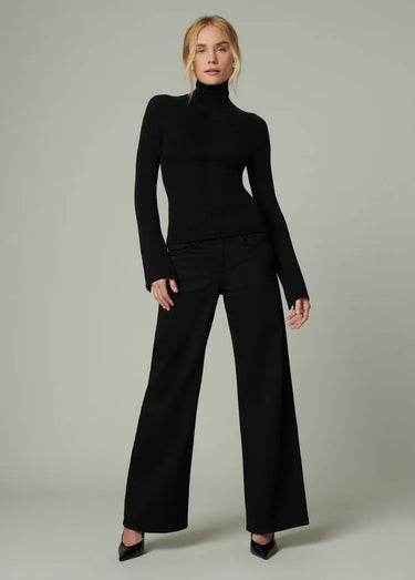 Joe’s Jeans Lou Lou Low Rise Wide Leg Jean in Black styled with a fitted black turtleneck and heels
