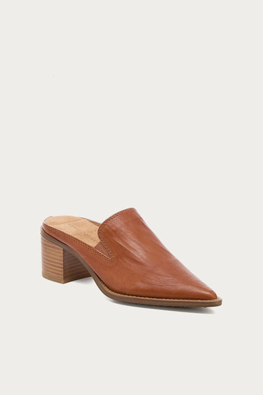 A single tan leather mule shoe with a pointed toe and a stacked wood-look block heel, shown from a three-quarters angle on a light gray background.