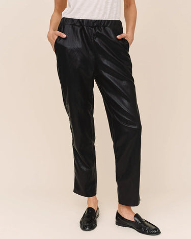 Bella Dahl Pull-On Elastic Waist Trouser in black faux leather, featuring a comfortable elastic waistband, front pockets and ankle-length straight legs.