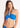 A woman wearing a bright blue halter bandeau swimsuit with soft cups, quick dry cups, and side boning. She is standing against a white background.
