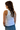 Woman wearing a white tank top and blue jeans on a white background