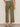 Person wearing olive green pants on a plain background