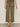Person wearing olive green pants on a plain background