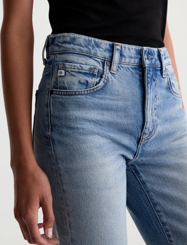 Close-up of blue jeans with a white background