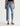 Light blue jeans worn by a person on a white background